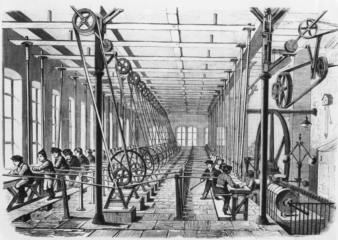 Kinder arbeiten im Jahr 1858 in einer Papiermühle in Aschaffenburg. Gezeigt werden große Laufräder, vor denen Kinder sitzen.
