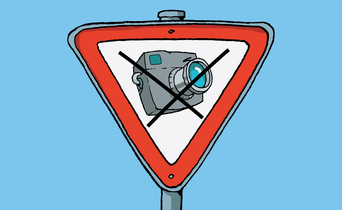 Fotografieren verboten, zeigt das Schild auf der Illustration