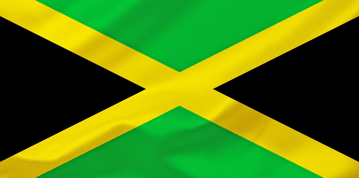 Die Flagge des Staates Jamaika zeigt die Farben schwarz, grün und geld