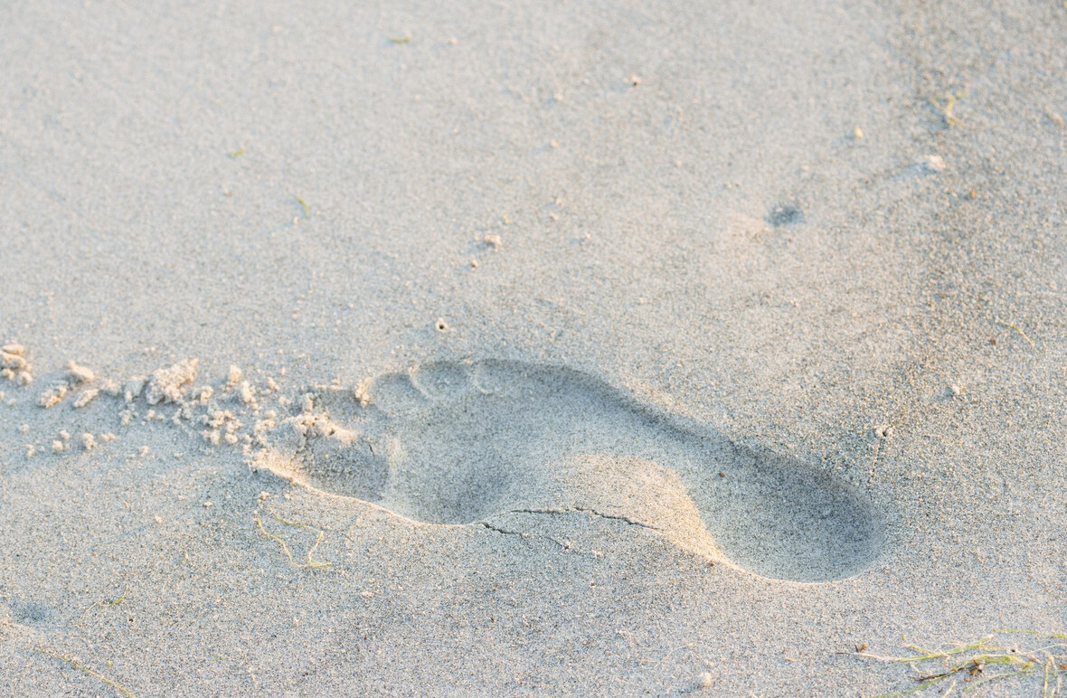 Fußabdruck im Sand