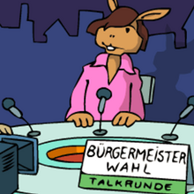 Eine Fernsehmoderatorin vor der Kamera.