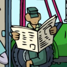 Ein Traktorfahrer liest Zeitung.